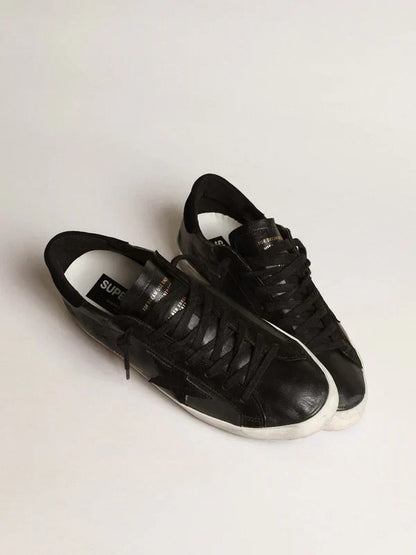 Super-Star in black nappa leather with a suede black star and heel tab 46