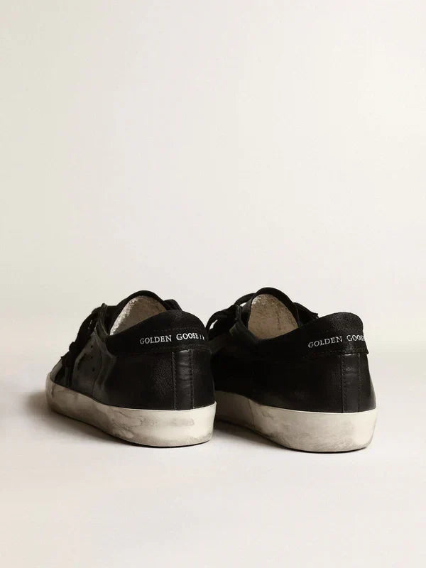 Super-Star in black nappa leather with a suede black star and heel tab