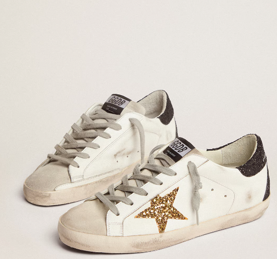 Super-Star LTD with a gold star and black glitter reinforcement